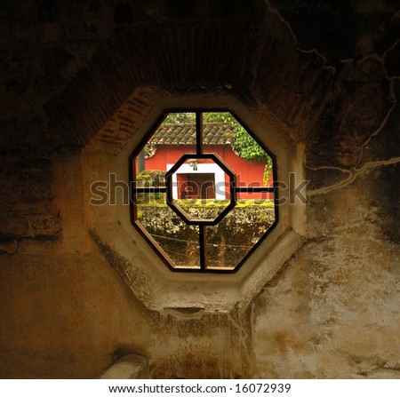 Time travel window looking through ruins at a door of today in Antigua Guatemala central america. looking from the past to the future.