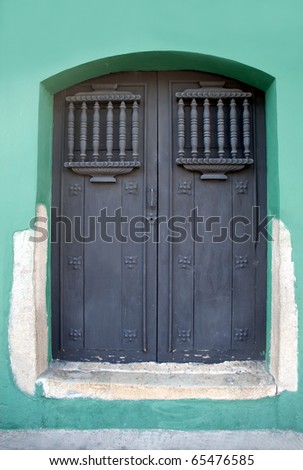 Guatemalan wooden crafted home door. handcrafted, and well used entryway.