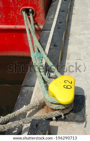 Fishing vessels hawsers attached  to the bollard