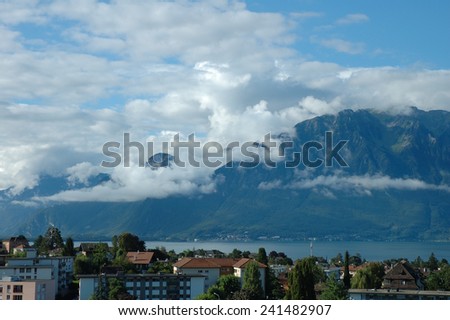 Mountains, Geneve lake and buildings in La Tour-de-Peilz in Switzerland