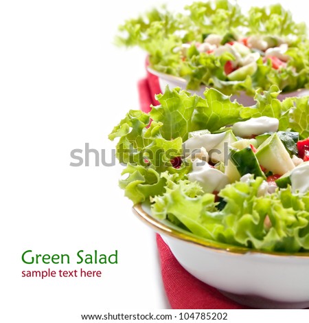 Lettuce with cucumber and zucchini, salad on the white background