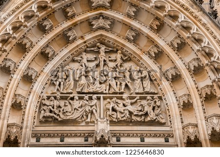 West facade of the Cathedral of Saints Vitus built in the 14th century. Bas-relief and decor of top part of the main portal, Prague, Czech Republic