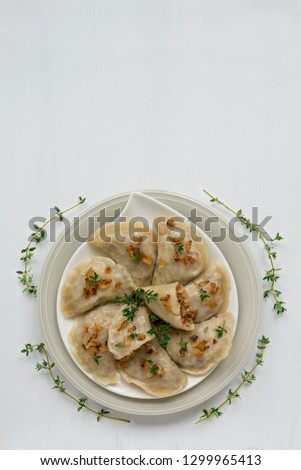Dumplings with buckwheat porridge and fried onions. This is a very popular food in Poland. Homemade food