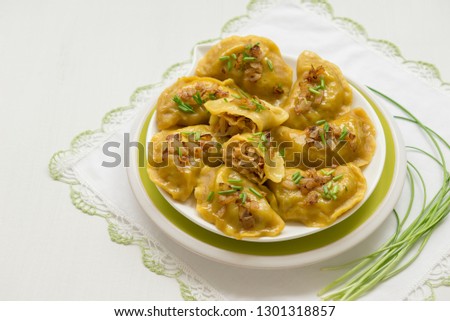 Dumplings with cabbage and fried onions. This is a very popular food in Eastern European countries, Poland, Ukraine and Russia. Homemade food