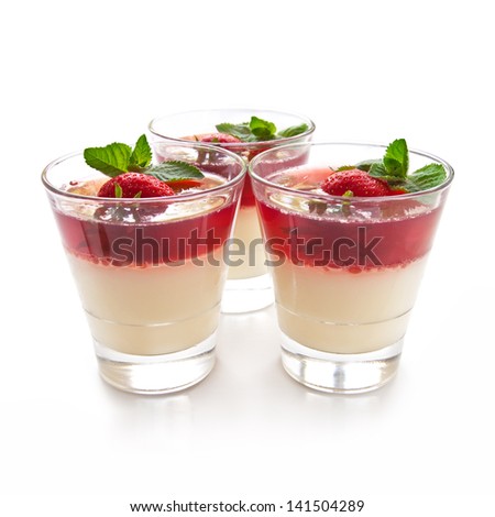 Jelly with strawberry in the glass topped mint leaf