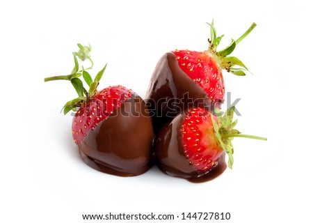 Strawberries dipped in delicious chocolate isolated on the white background
