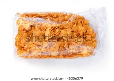 Crispy corn flakes in the transparent packaging