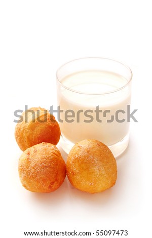 breakfast glass of milk and donut isolated on white