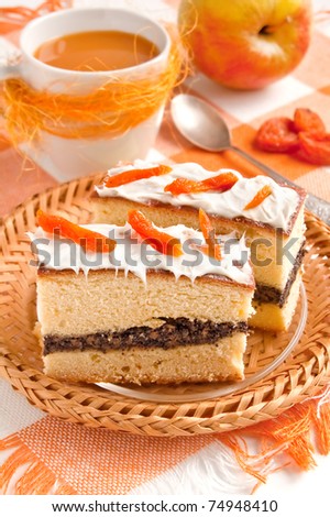 Slice of cake with poppy seeds and apricot decor