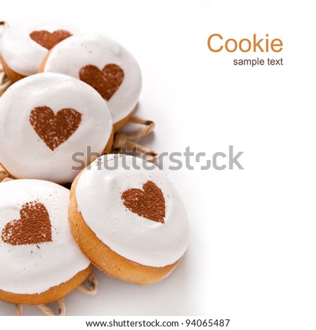 Homemade cookies with white cream and a drawing of the heart