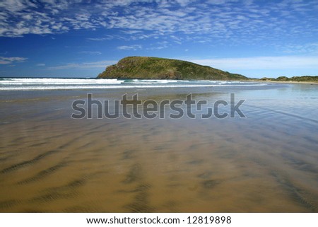 Low tide is coming in Cannibal Bay. Wide angle shot of Catlins shore. South Island. New Zealand