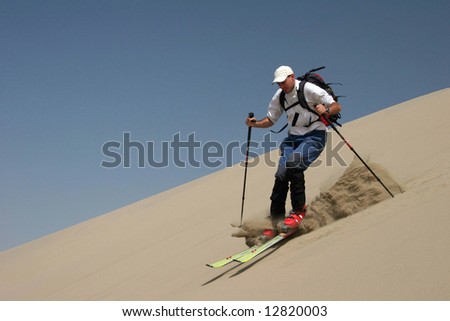 stock-photo-male-is-skiing-on-the-sand-dunes-of-huacachina-peru-12820003.jpg