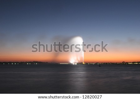Colorful jet of water at dusk. Jeddah. Saudi Arabia