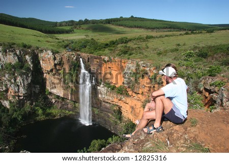 Couple enjoying the beauty in nature. Famous Berlin falls. South Africa