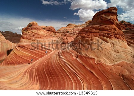 Walking on a perfect rock formation in Vermillion Cliffs Wilderness. Famous rock formation in Pariah Canyon. Utah. America