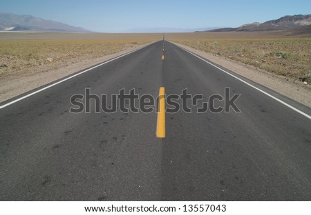 Road leading through famous natural landmark Death Valley. Death Valley national park. California. USA