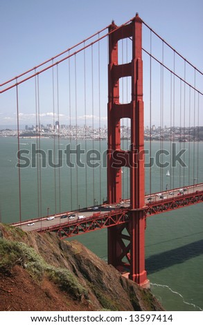 A traffic flows along the glowing Golden Gate Bridge. San Francisco, California, USA