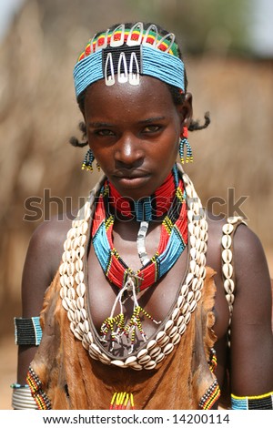 stock photo ETHIOPIA UNKNOWN A young female tribal member wearing 