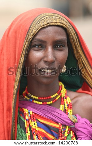 KENYA - UNKNOWN: A African woman wearing traditional clothes poses for a portrait in this undated image taken in Kenya.