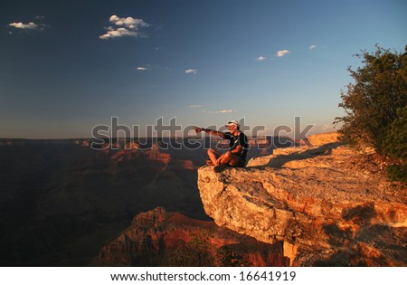 Trekker admiring Grand Canyon at sunset. Grand Canyon national park. Arizona. USA