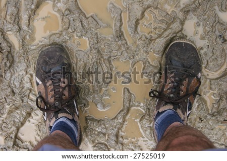 Unrecognized person with trekking shoes stick in the mud.  Valle de Cocora, Salento, Colombia