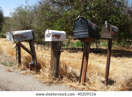 A row of mail boxes in a rural community. USA.