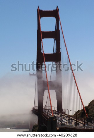 A traffic flows along the glowing Golden Gate Bridge. San Francisco, California, USA