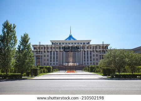Ministry of Defence in Astana Astana, Kazakhstan - August 10, 2014: The photograph shows the city of Astana, building of the Ministry of Defence of the Republic of Kazakhstan, trees and cloud.
