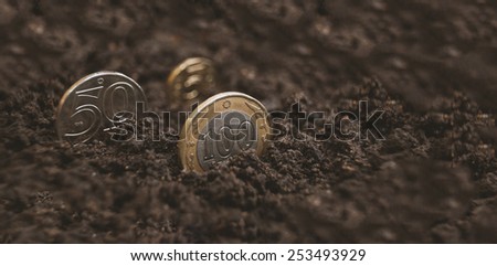 Coins tenge, Kazakh money grow from land