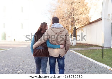 Young couple walking in autumn city