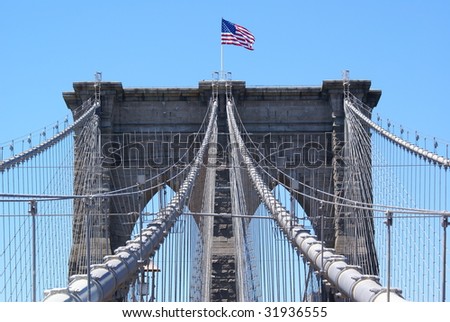 stock-photo-american-flag-waving-over-the-brooklyn-bridge-31936555.jpg