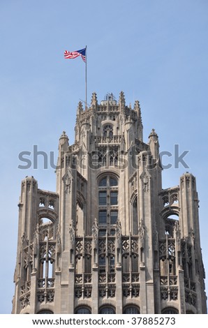Flag waving atop the Tribune Tower in Chicago, Illinois.