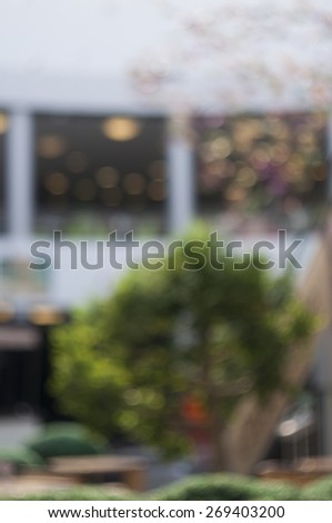 Blurred background: interior of shopping-mall gallery, shop-windows, bokeh lights