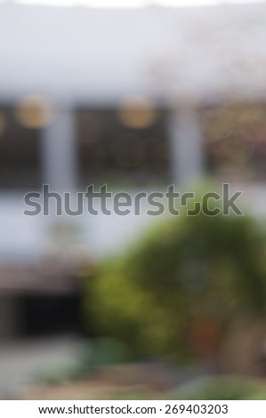 Blurred background: interior of shopping-mall gallery, shop-windows, bokeh lights