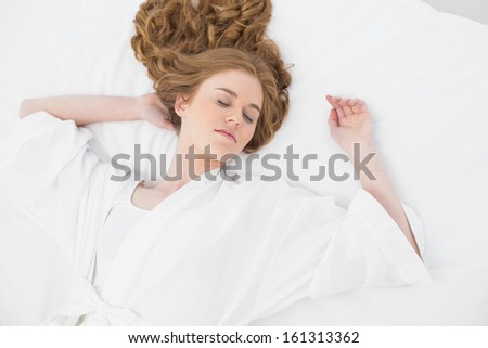 Overhead view of a pretty blond sleeping in bed at home