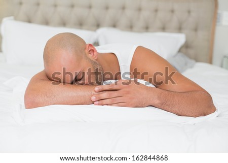 Close up of a young man sleeping in bed at home