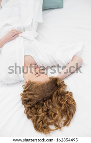Overhead view of a pretty young woman sleeping in bed at home