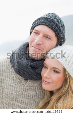 Close-up of a romantic young couple in warm clothing outdoors