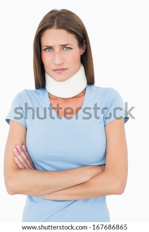 Portrait of a young woman wearing cervical collar over white background