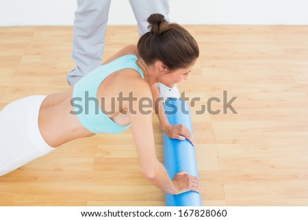 Side view of a young woman do push ups in the gym at hospital