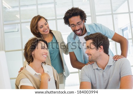 Group of young business people having a conversation in the office