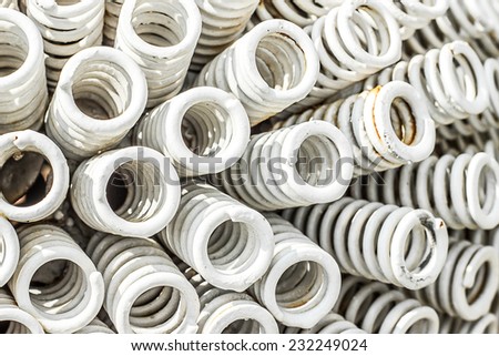 Close-up of old coiled metal white springs.