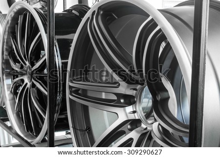 Shop shelves with automobile car alloy wheels.