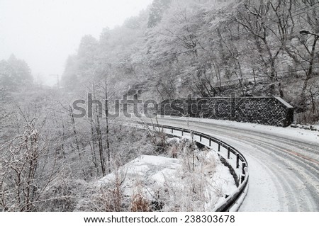 curve made  dangerous by snow