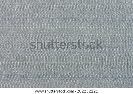 Detail of gray polyester fabric with blue threads.