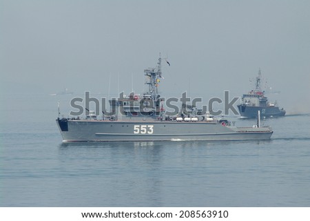 VLADIVOSTOK, RUSSIA - JULY 27: Ships minesweepers of the Russian Pacific Fleet at the naval parade in the Amursky Bay on the Day of of the Navy Russian, July 27 2014, Vladivostok, Russia.