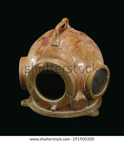 Vintage diving helmet isolated on a black background.