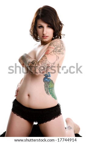 stock photo : pretty pin-up tattoo girl kneeling