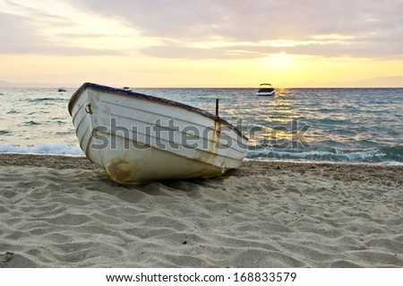 Old Wooden Fishing Boat On The Seashore At Sunrise Stock Photo ...