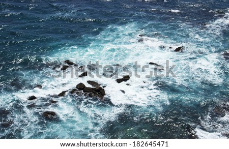 Waves and rocks, stones on the Ocean from above. View from lighthouse, Matara, Ceylon, Sri Lanka